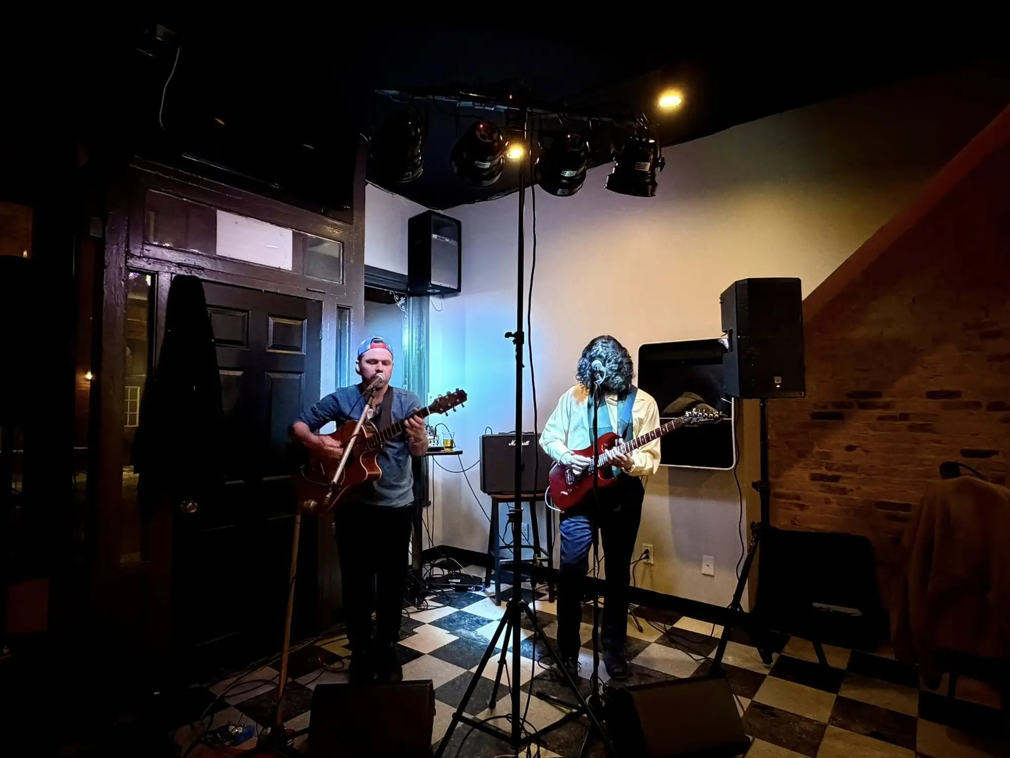 Musicians performing on stage at Tavern Off Main